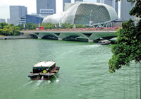 Boat on the river leading under Nicoll highway to the theater Esplanade